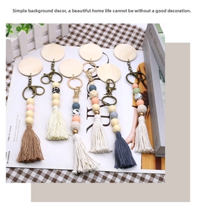 Detail of bohemian tassel keychain set with silicone beads and wooden discs for bag decor