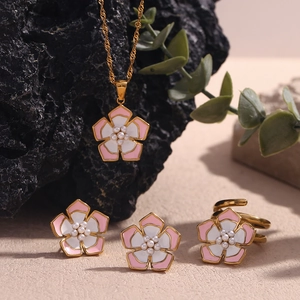 Detailed set of 18K gold plated flower necklace, earrings and ring with pink enamel