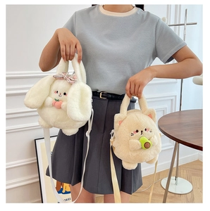 Detail of plush crossbody bags in cute white rabbit and beige cat cartoon shapes