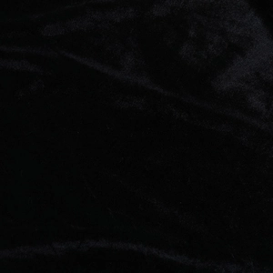 Détail du tissu en velours noir montrant la texture douce et l'éclat luxueux