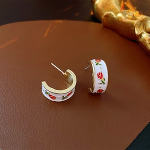 Elegant French gold C-shape hoop earrings with white enamel and red tulip floral pattern