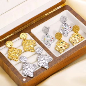 Lava textured titanium steel geometric earrings with colorful zircons in a wooden box