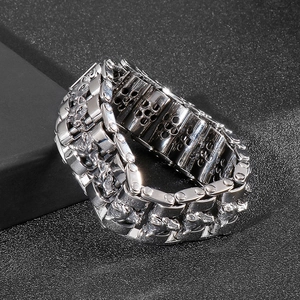 Macro shot of silver heavy-duty wolf head biker bracelet with intricate carving details