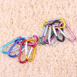 Close-up of assorted colorful D-ring aluminum carabiners in blue, red, gold and black