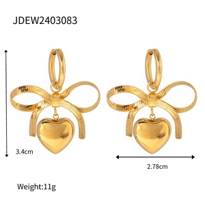 Detailed dimensions of gold bow heart earrings showing height, width and weight