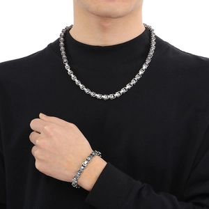Detailed view of silver Byzantine style stainless steel necklace and bracelet set for men