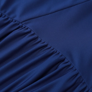 Detailed view of dark blue ribbed knit fabric showing elegant ruched stitching and texture