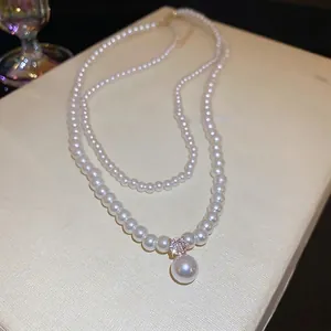 Elegant double-layer pearl necklace with a large pendant and a sparkling zircon stone
