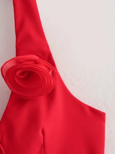 Close-up of vibrant red 3D chiffon flower decoration and wide shoulder strap detail