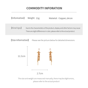Detailed size specifications for golden tassel earrings with zircon stars on white background