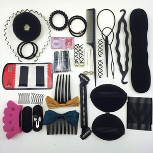 Flat lay of professional hair styling tools set with pins, combs and bun makers