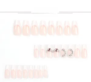 Detail of 24pcs nude French coffin press-on nails with star and moon rhinestones