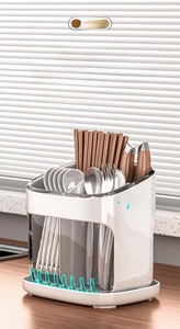 Detail of the kitchen utensil holder featuring high-low compartments and ventilation holes