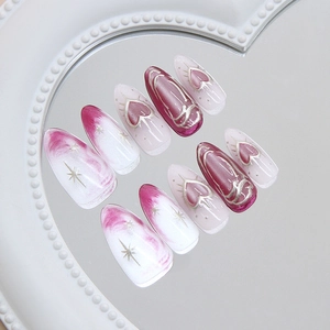 Pink and white cat-eye press on nails with 3D silver heart and long almond shape