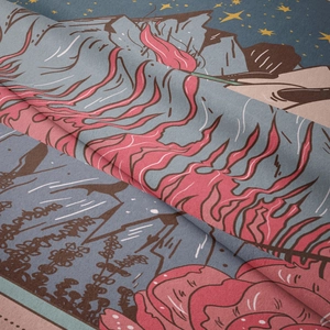 Detail of tapestry fabric texture with bohemian mountain and starry sky patterns