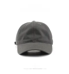 Front view of a dark grey cotton baseball cap with classic six-panel structure and curved brim