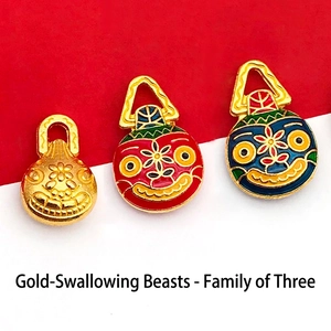 Detailed view of three enamel gilded mythical beast pendants with vibrant traditional colors