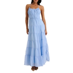 Light blue tiered halter maxi dress with ruched bodice details on plain white background