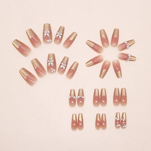 Detailed set of 24 coffin-shaped press-on nails with pearls and butterfly rhinestone art