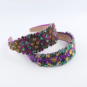 Baroque style headbands with purple crystals and colorful rhinestones on white background