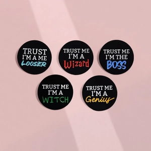 Set of 5 black enamel pins with TRUST ME I'M A Wizard BOSS Genius text design