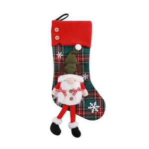 Red plaid Christmas stocking with 3D plush gnome and snowflake patterns for decoration