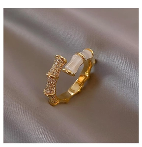 Detailed view of bamboo joint ring with micro-pave zircons and cat's eye stone detail