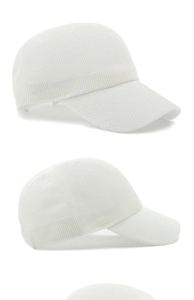 Detail of white breathable mesh baseball cap showing knit hollow out fabric texture