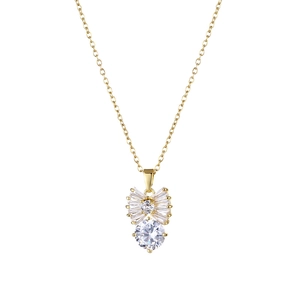 Elegant gold bow necklace with fan-shaped cubic zirconia pendant on white background