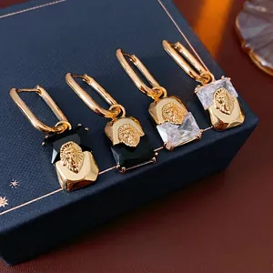 Vintage gold-plated lion head hoop earrings with black and clear zircon rectangular stones