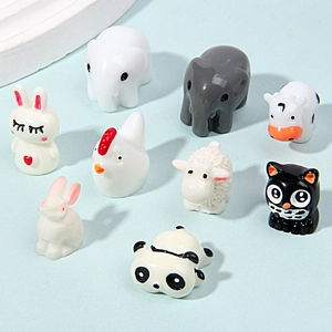 Set of 9 miniature ceramic animal figurines including elephant cow and panda decor