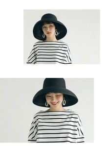 Detailed views of women's vintage black straw sun hat with a wide brim for beach sun protection