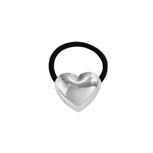 Close-up of polished silver heart charm on a black high-elastic hair tie for women