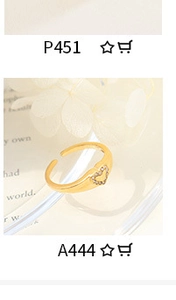 Detail of adjustable gold ring featuring a heart-shaped centerpiece with sparkling zircons