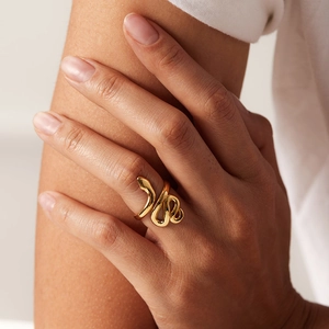 Elegant 18K gold plated stainless steel snake ring worn on a finger for daily styling
