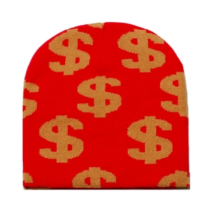 Detail of red knit beanie with golden dollar sign patterns showing the premium texture