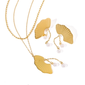 Golden fan-shaped necklace and earrings jewelry set with elegant white pearl drops