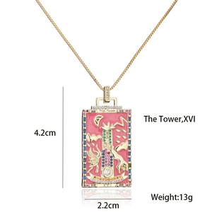 Detail of 18K gold plated The Tower tarot card pendant with pink enamel and zircons
