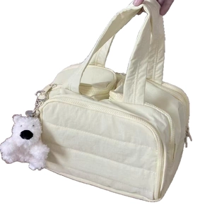 Quilted cream vanity case with multi-zipper compartments and cute bear pendant