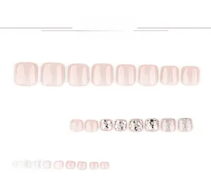 Detail view of pink and glitter champagne gold cat-eye press-on toenails set