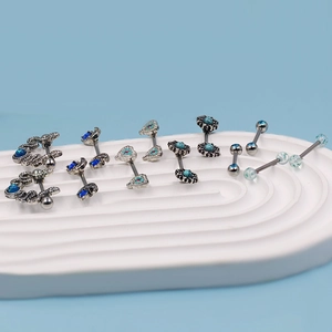 Detailed set of blue stainless steel nipple rings with snake, heart and moon designs