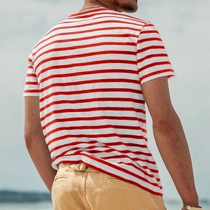 Outdoor shot of men's red and white striped crew neck t-shirt with breathable cotton texture