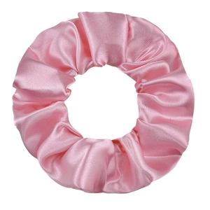 Detailed view of glossy bright pink satin scrunchie showing fabric folds and texture