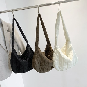 Quilted tote bags in black, army green and white made of puffy nylon material