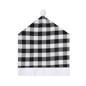 Christmas dining chair cover with black and white buffalo plaid pattern and white pom-pom