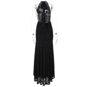 Detailed view of black polka dot halter dress with backless design and mermaid hemline