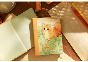 Detail of A7 notebook with cute orange cat illustration and kittens save the world text