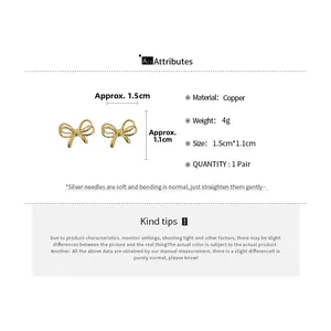 Detail showing dimensions of golden bow stud earrings with copper material and silver pins