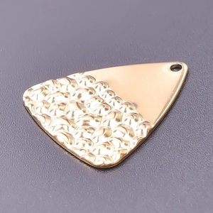 Detail of 18k gold plated triangle pendant featuring smooth and hammered metal textures