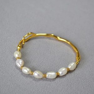 Elegant gold irregular branch bracelet with white baroque pearls in vintage style